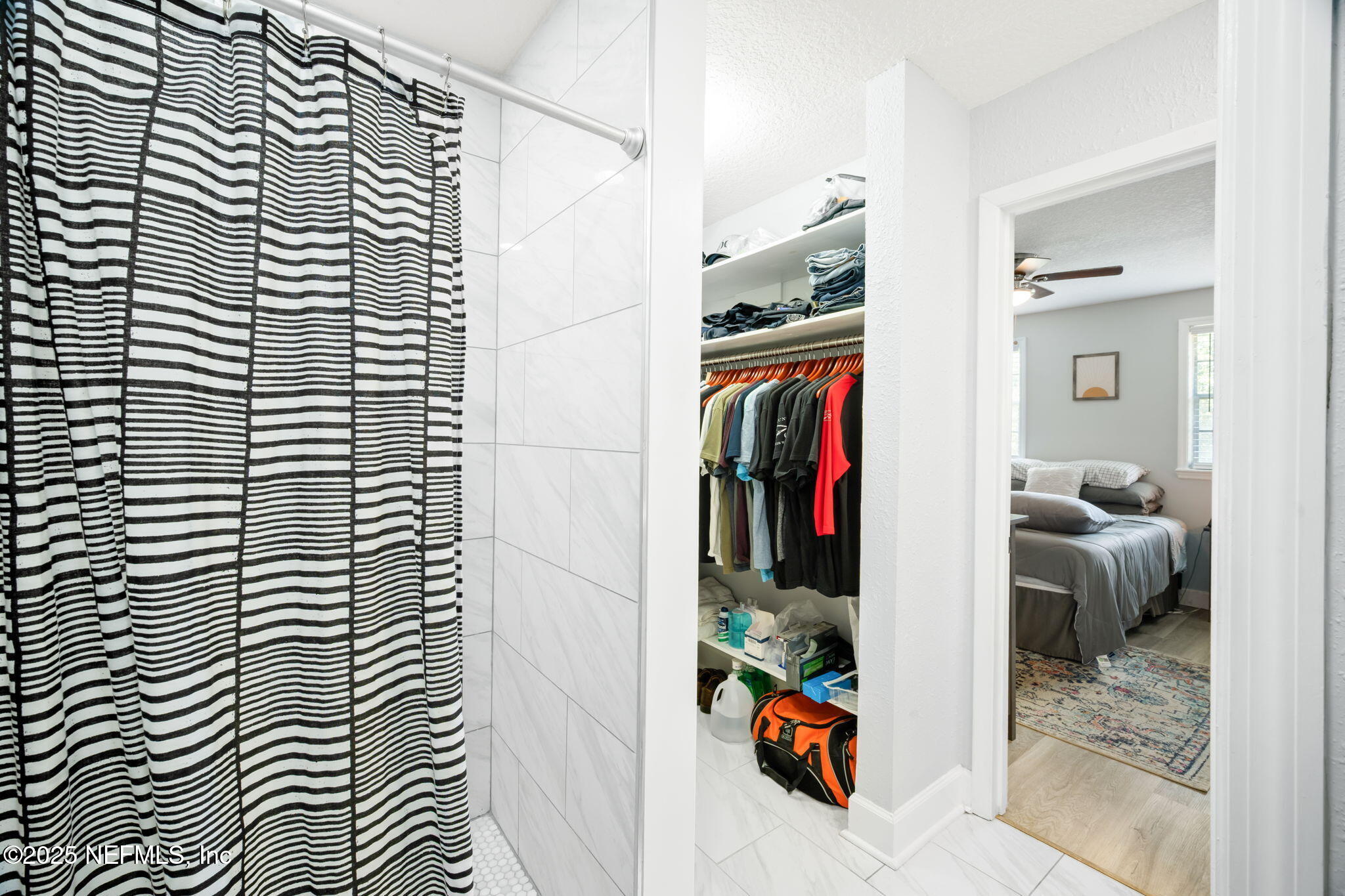 4915 Baymeadows Road, Unit 8H Jacksonville, FL 32217 - Photo 13 of 20 a view of walk in closet with clothes and shoes