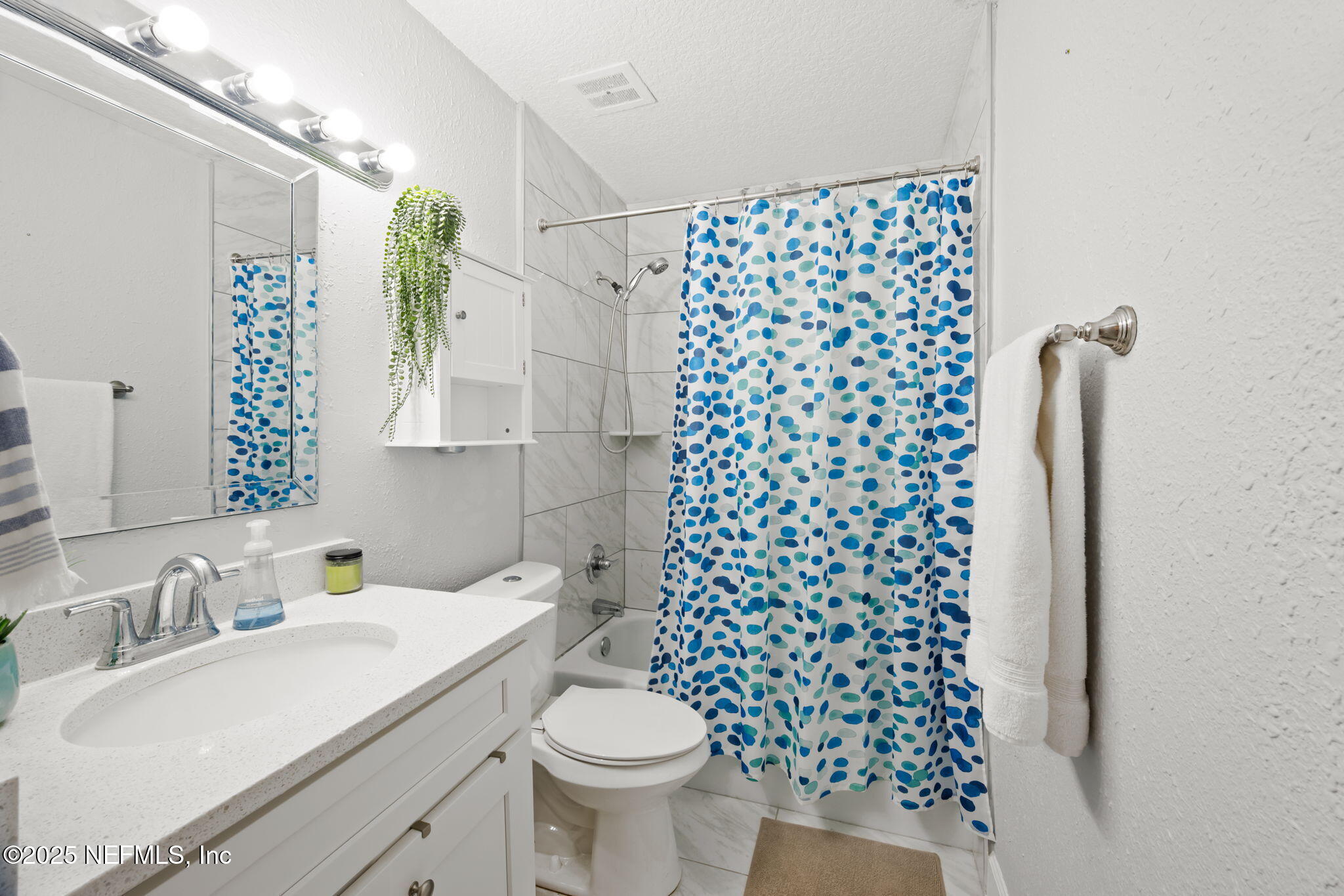 4915 Baymeadows Road, Unit 8H Jacksonville, FL 32217 - Photo 15 of 20 a bathroom with a sink toilet and shower