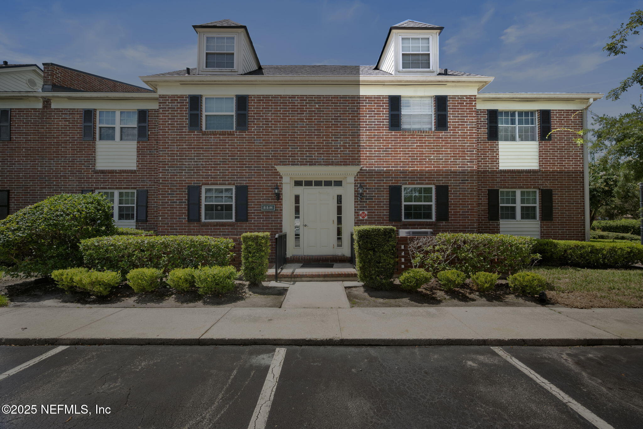 4915 Baymeadows Road, Unit 8H Jacksonville, FL 32217 - Photo 19 of 20 a front view of a house with a yard