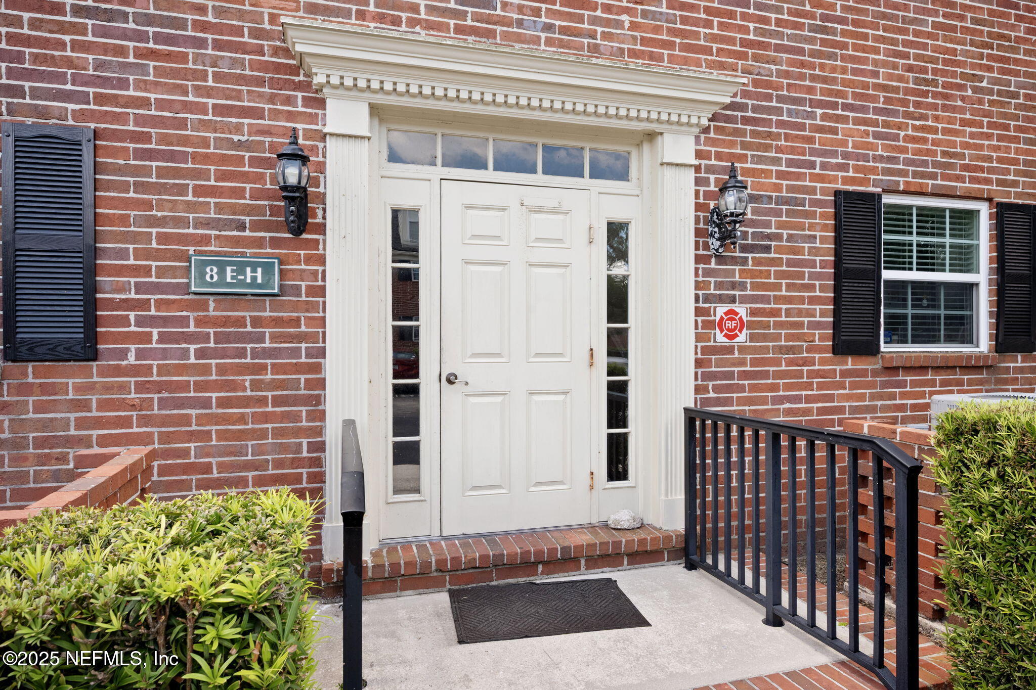 4915 Baymeadows Road, Unit 8H Jacksonville, FL 32217 - Photo 3 of 20 a view of a brick house with a door
