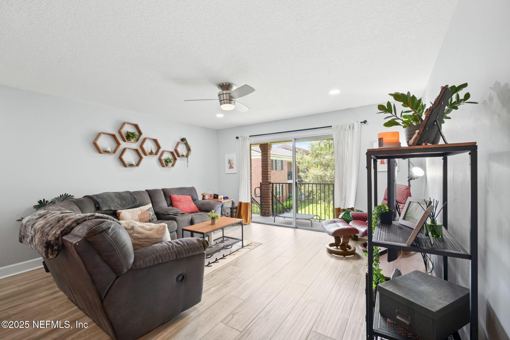 4915 Baymeadows Road, Unit 8H Jacksonville, FL 32217 - Photo 6 of 20 a living room with furniture and a large window