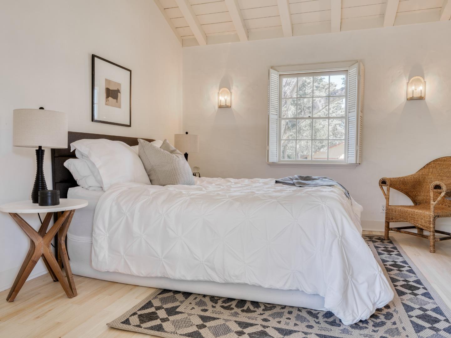 150 Littlefield Road Monterey, CA 93940 - Photo 21 of 51 a spacious bedroom with a bed and chair