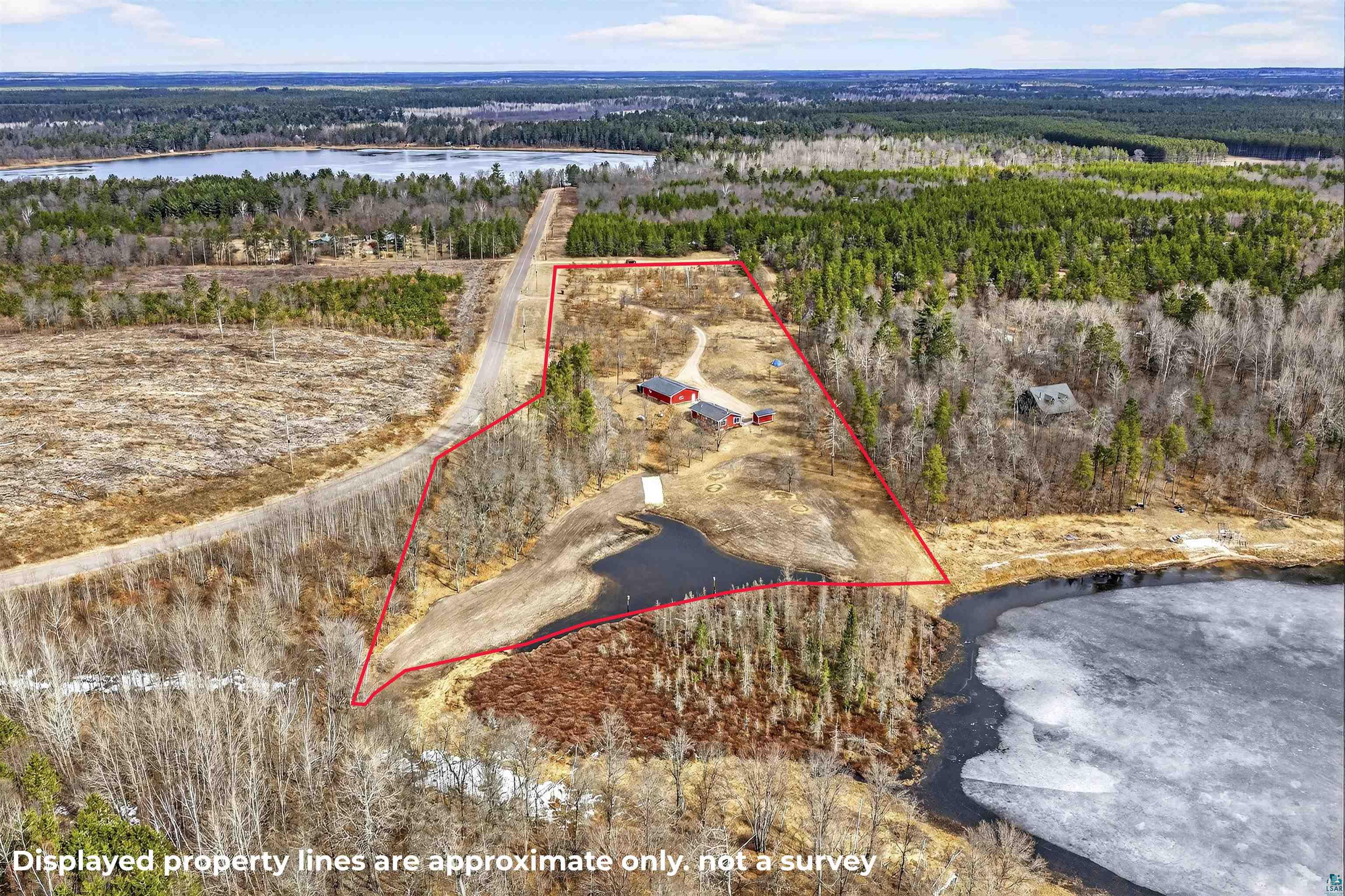 11702 East Mail Road Gordon, WI 54838 - Photo 28 of 49 Aerial overview of property's location with property parcel outlined and a nearby body of water