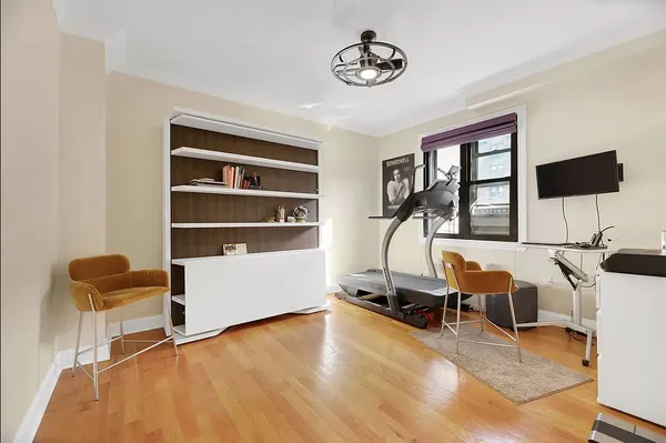 a view of a livingroom with furniture and a window