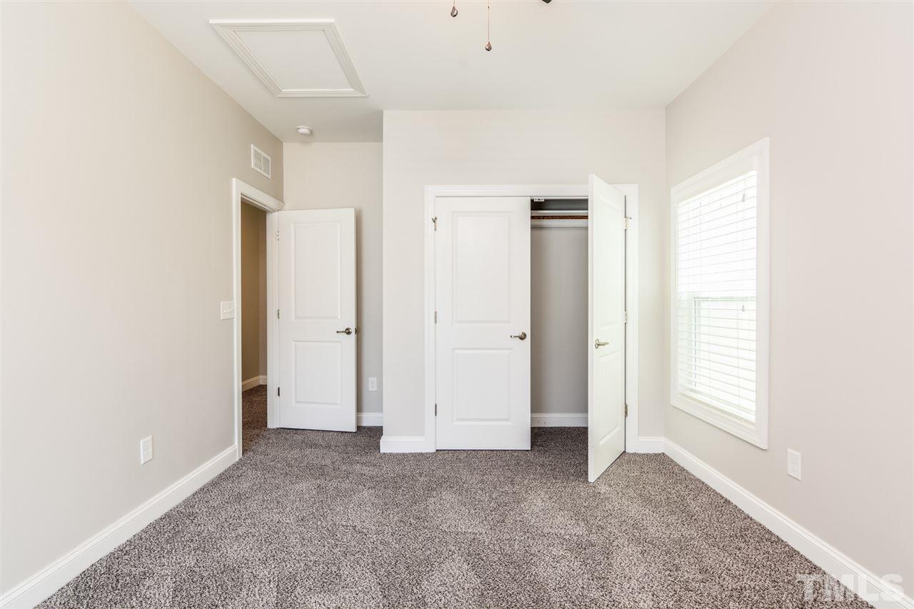 5646 Wade Park Boulevard Raleigh, NC 27607 - Photo 12 of 20 an empty room with windows and closet