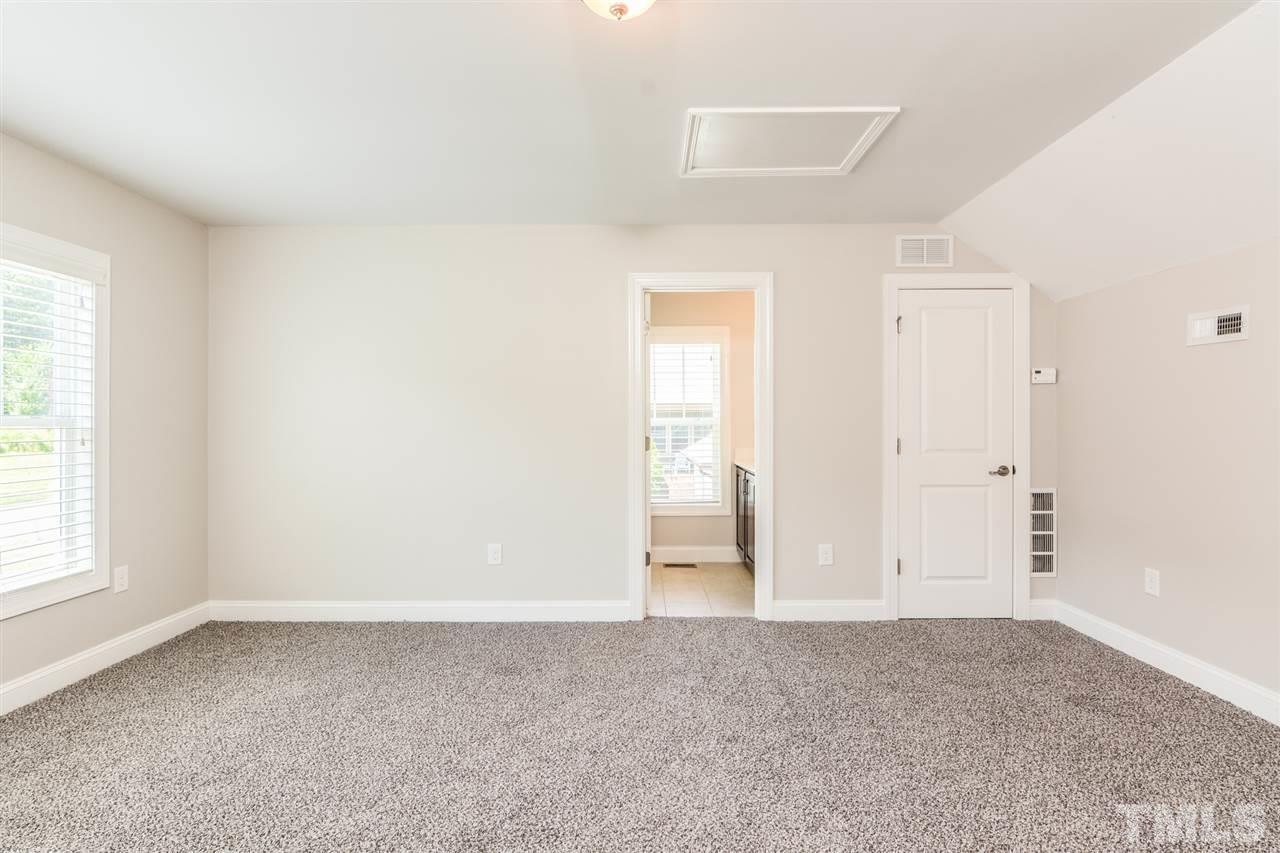 5646 Wade Park Boulevard Raleigh, NC 27607 - Photo 14 of 20 an empty room with windows and closet
