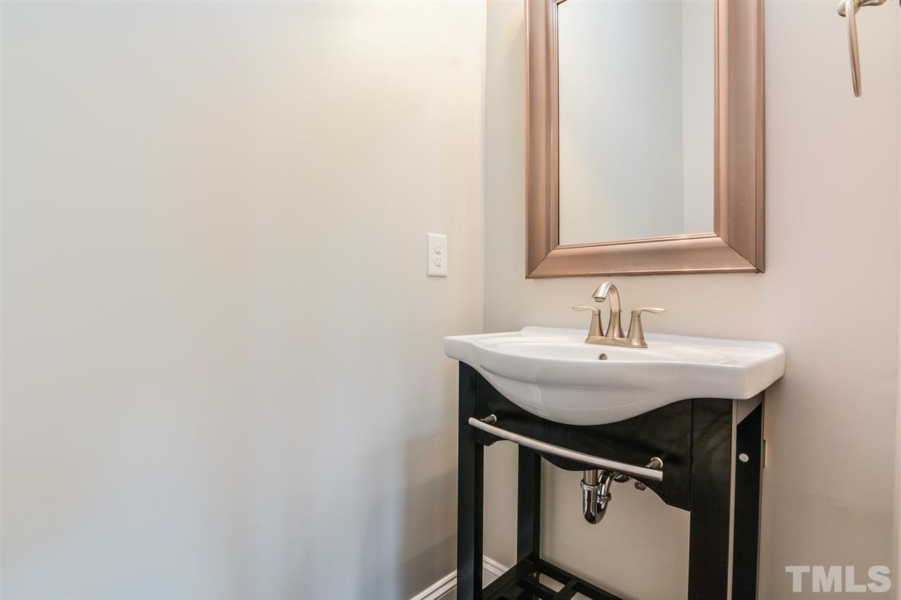 5646 Wade Park Boulevard Raleigh, NC 27607 - Photo 17 of 20 a sink with a mirror