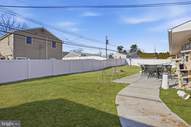 a view of a backyard with sitting area