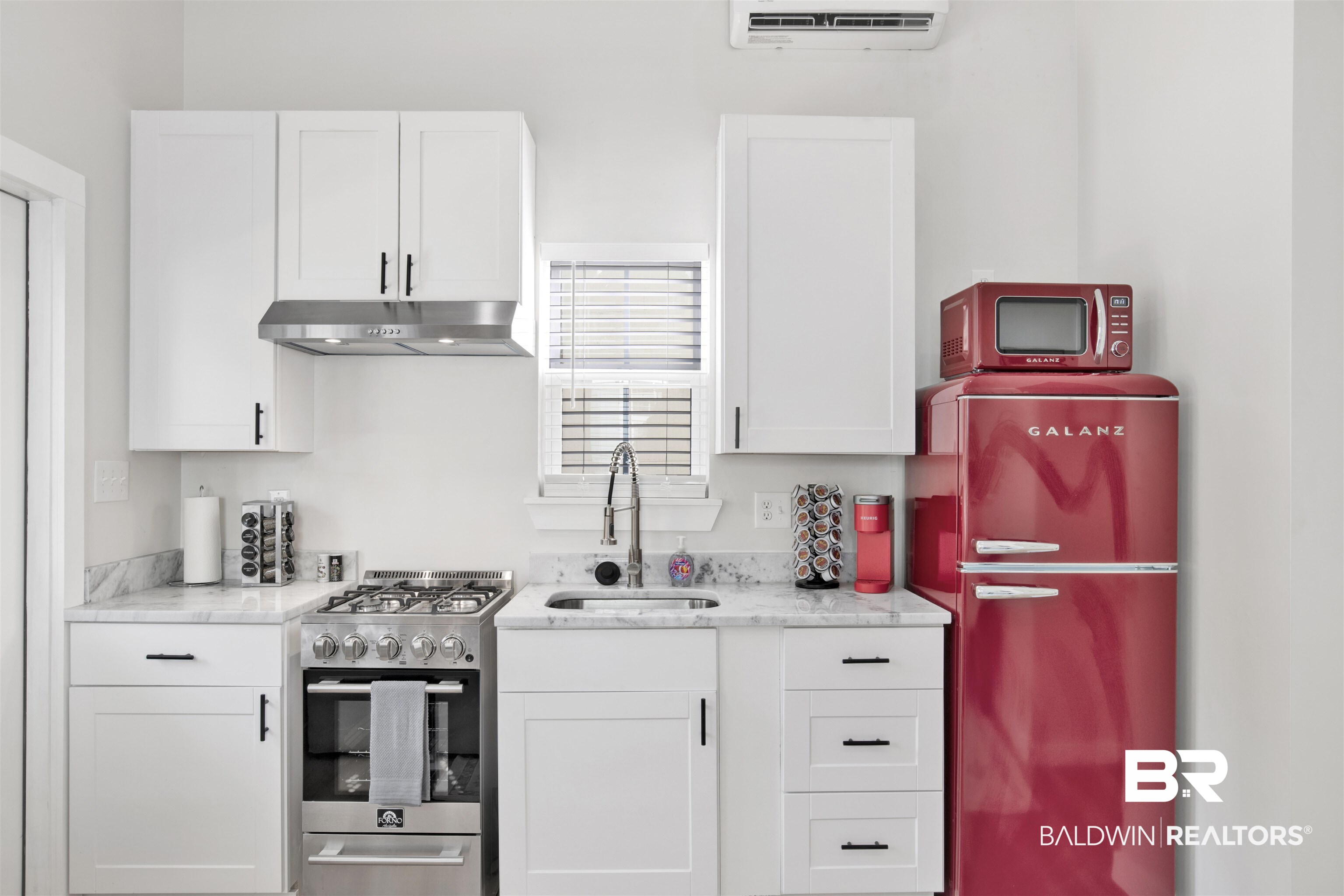 551 Congress Street Mobile, AL 36603 - Photo 10 of 19 Kitchen featuring stainless steel gas range and white cabinets