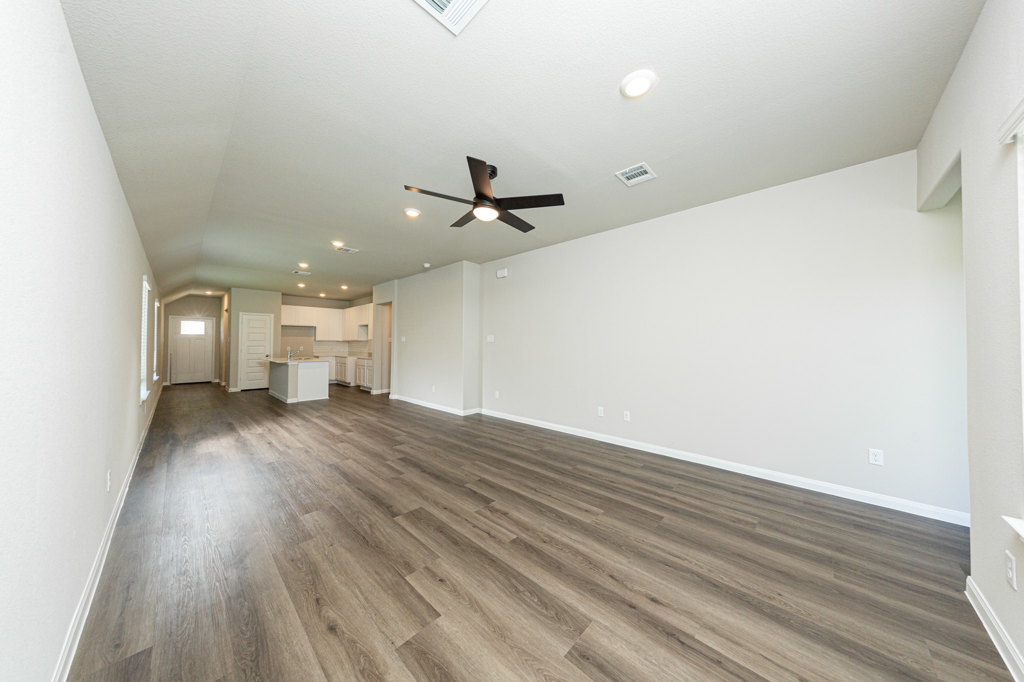 13654 Kit Run Splendora, TX 77372 - Photo 5 of 24 a view of empty room with wooden floor