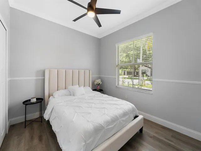 a bedroom with a bed and a window