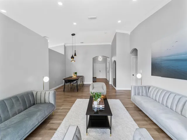 a living room with furniture and a table