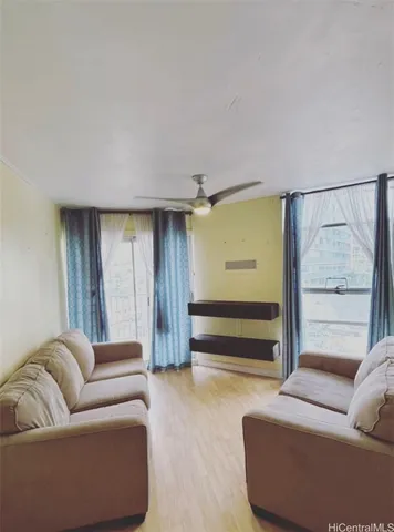 a living room with furniture and a window