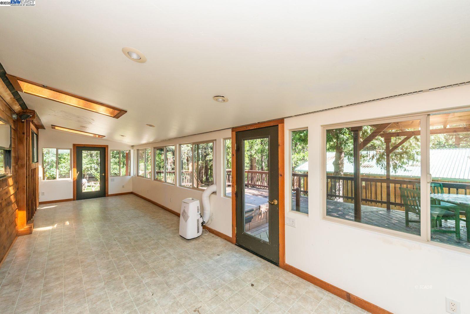 4481 Rush Creek Road Lewiston, CA 96052 - Photo 11 of 50 a view of an empty room with large windows