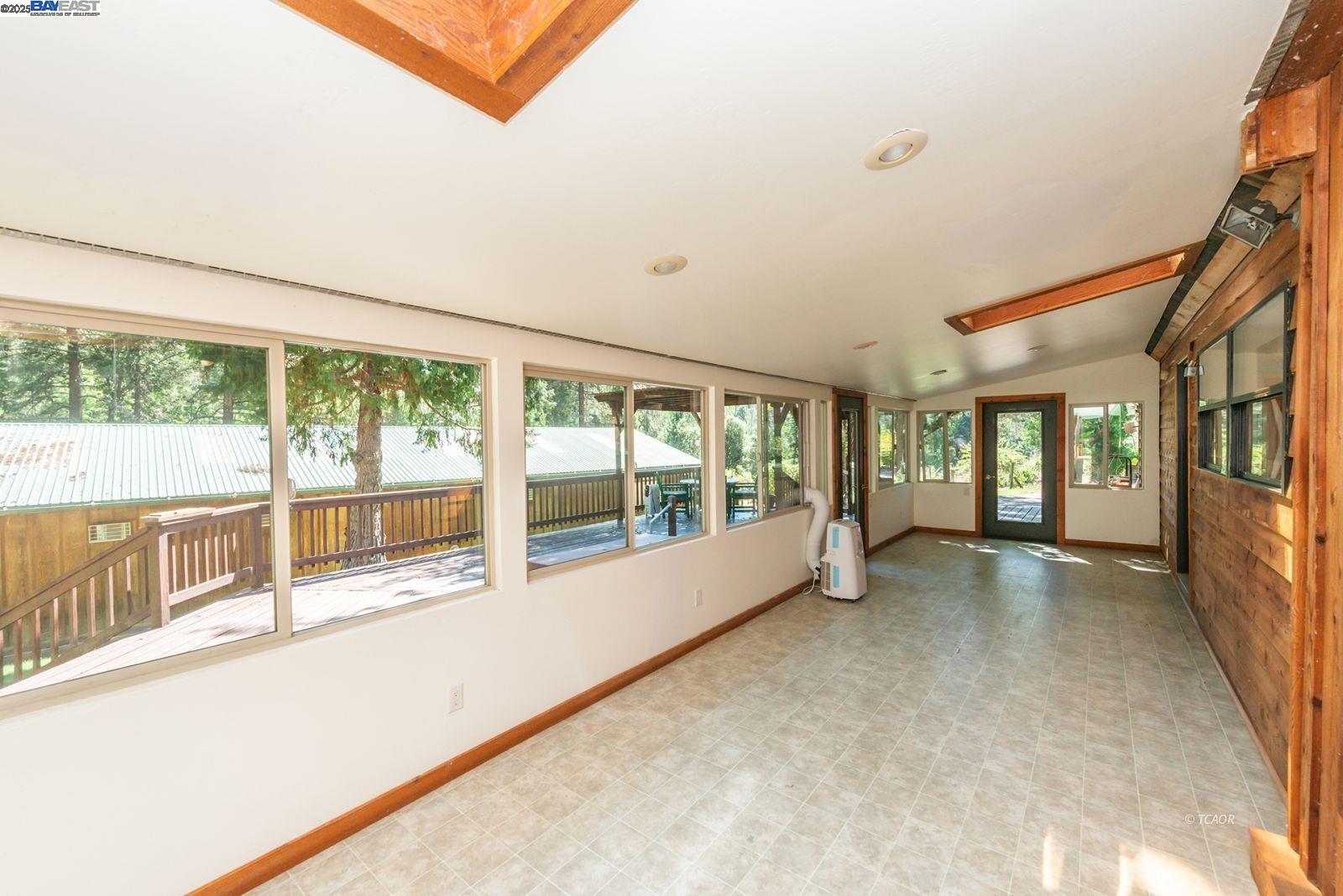 4481 Rush Creek Road Lewiston, CA 96052 - Photo 12 of 50 a view of an empty room with wooden floor and a window