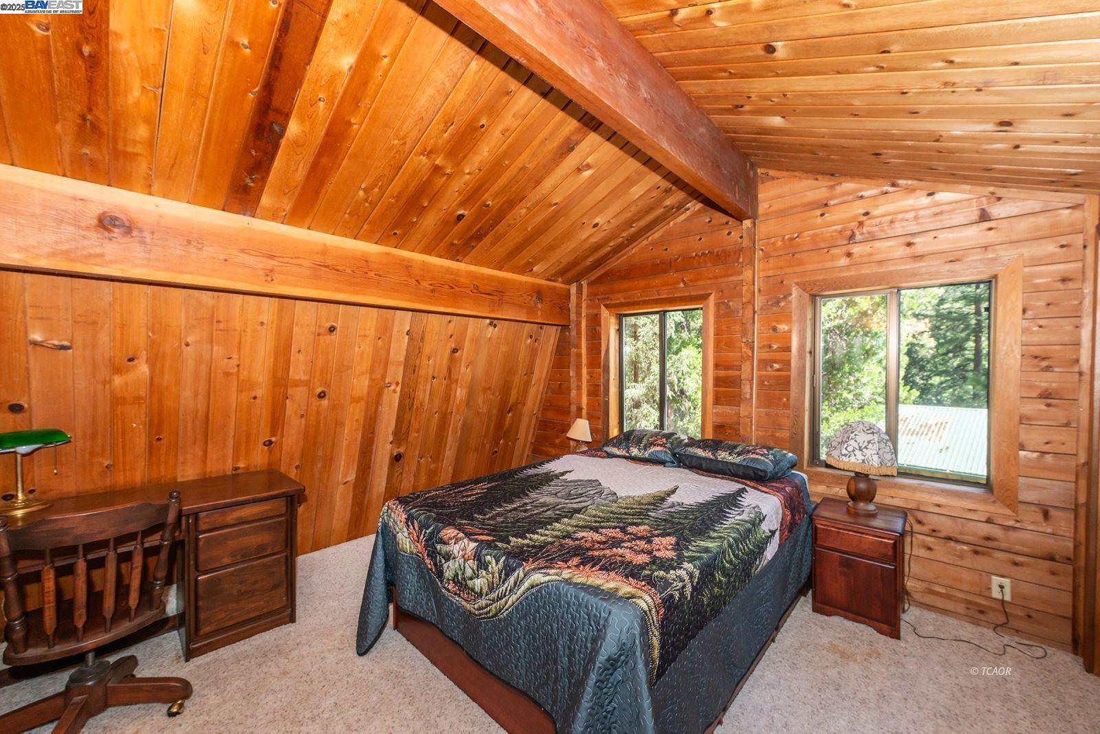 4481 Rush Creek Road Lewiston, CA 96052 - Photo 28 of 50 a bed sitting in a bedroom next to a window