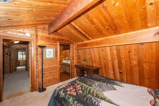 a bathroom with a sink a toilet and shower curtain