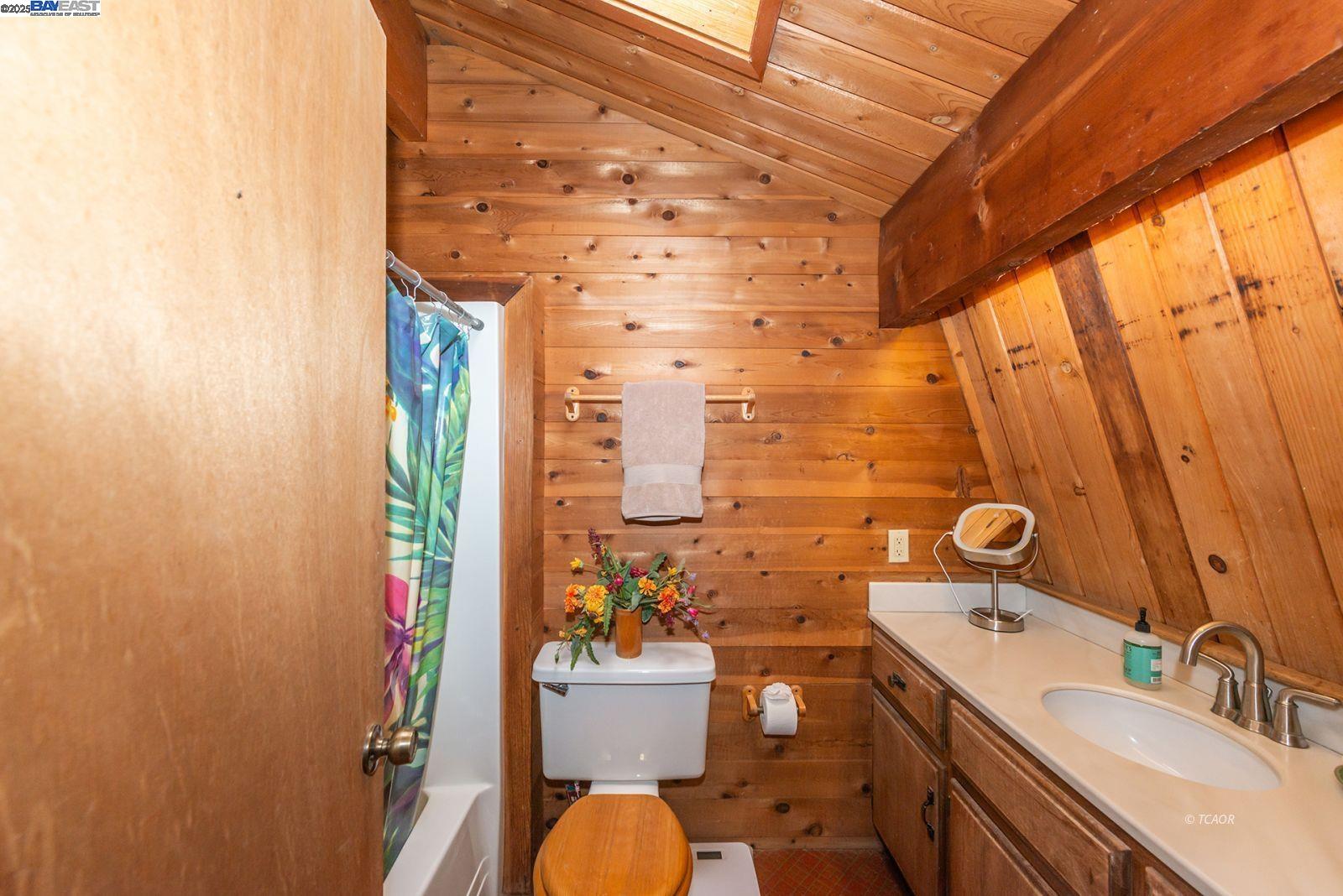 4481 Rush Creek Road Lewiston, CA 96052 - Photo 30 of 50 a bathroom with a sink a toilet and shower curtain