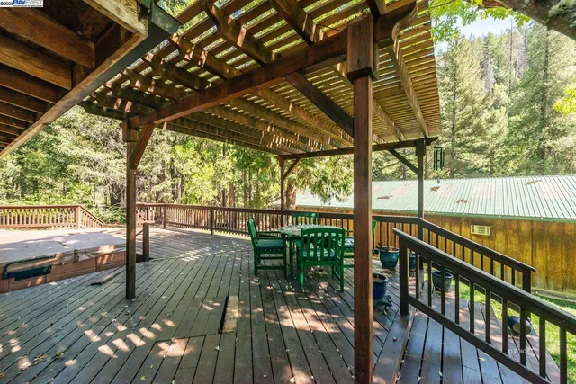 a view of a porch with wooden floor