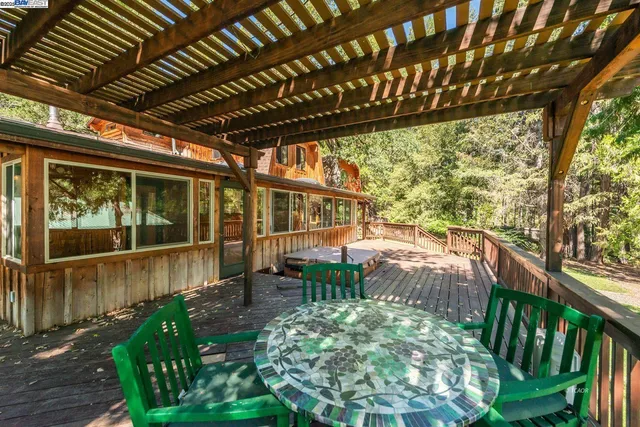 a view of a balcony with wooden floor