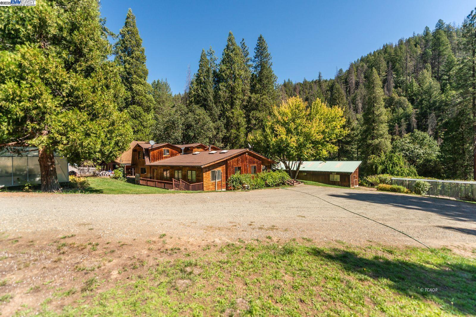 4481 Rush Creek Road Lewiston, CA 96052 - Photo 44 of 50 a view of a house with a yard and large tree