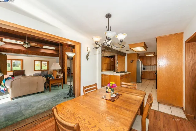 a very nice looking dining room with a table and chairs