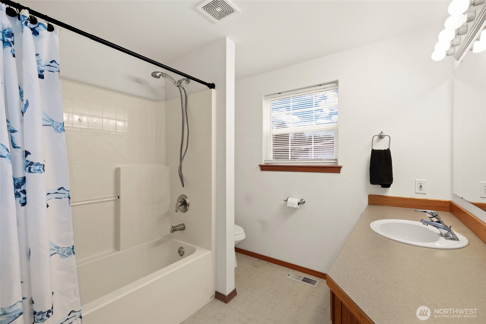 18207 Keona Lane Southwest Rochester, WA 98579 - Photo 14 of 35 a bathroom with a tub a sink and a shower