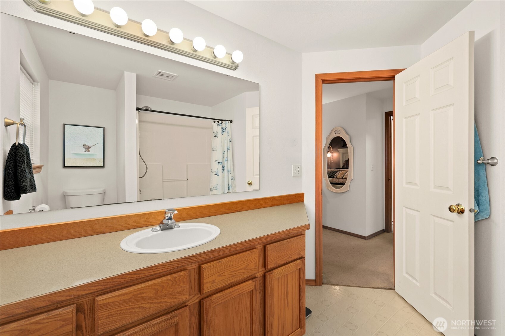 18207 Keona Lane Southwest Rochester, WA 98579 - Photo 15 of 35 a bathroom with a sink double vanity and a mirror