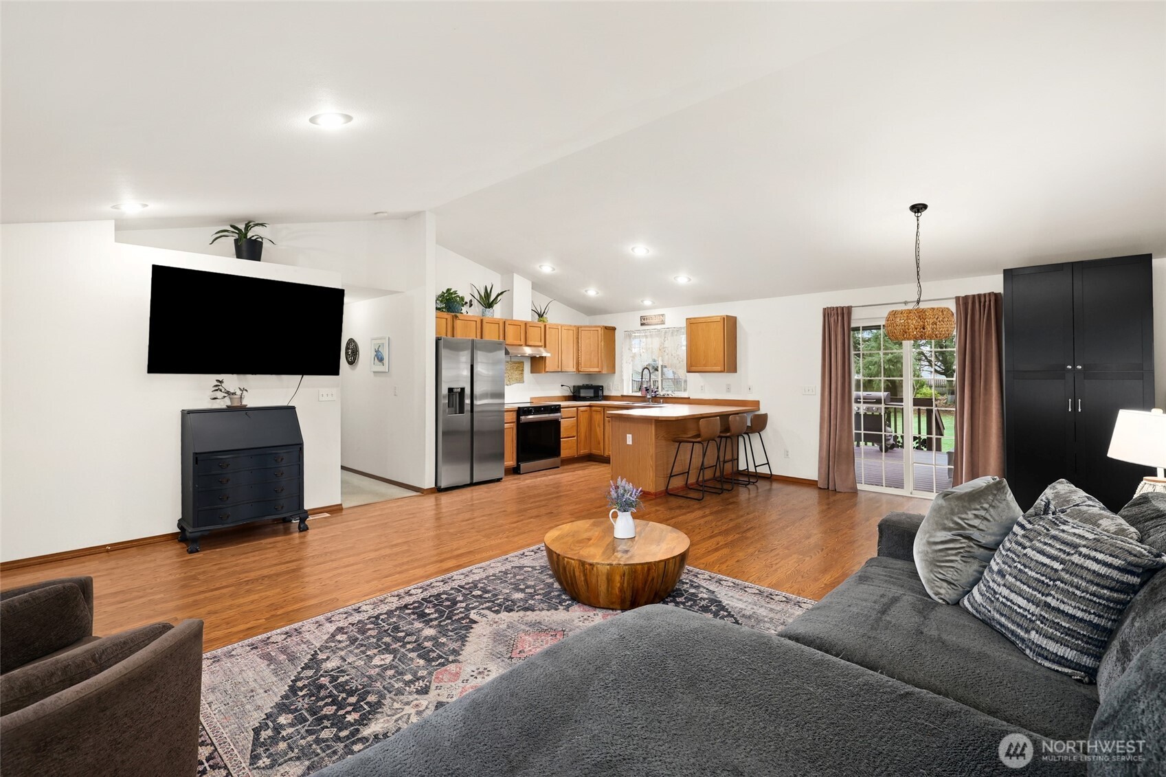 18207 Keona Lane Southwest Rochester, WA 98579 - Photo 2 of 35 a living room with furniture and a flat screen tv