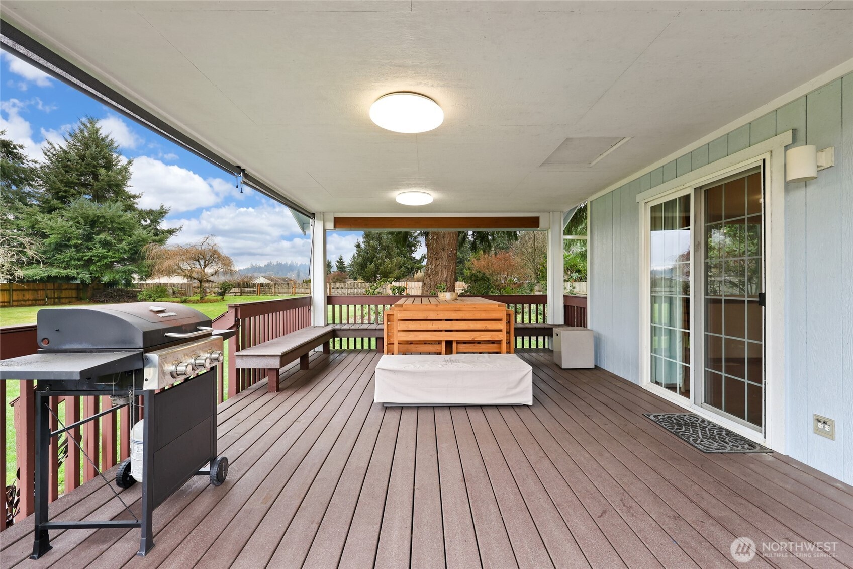18207 Keona Lane Southwest Rochester, WA 98579 - Photo 22 of 35 a view of a patio with wooden floor and iron stairs