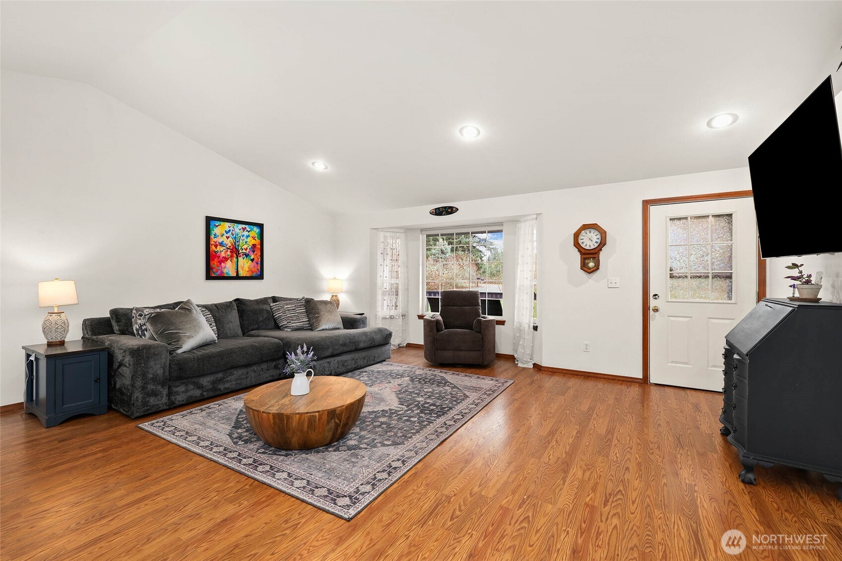 18207 Keona Lane Southwest Rochester, WA 98579 - Photo 3 of 35 a living room with furniture and a flat screen tv