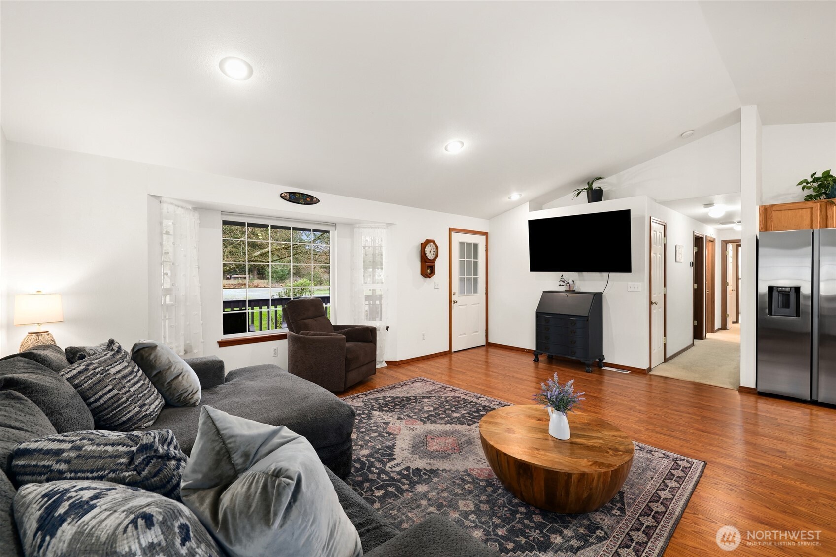 18207 Keona Lane Southwest Rochester, WA 98579 - Photo 4 of 35 a living room with furniture and a flat screen tv