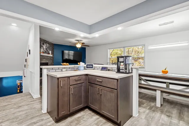a kitchen with a sink and cabinets