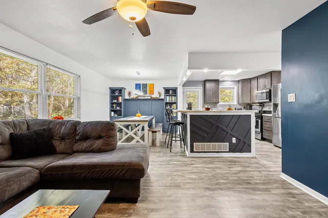 a living room with furniture and a fireplace