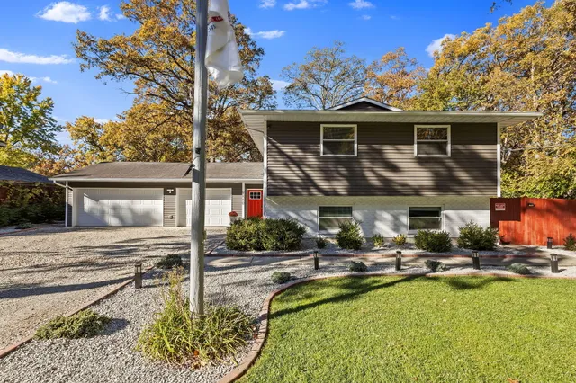 a view of a patio with couches chairs and swimming pool