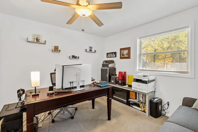a room with furniture pool table and windows