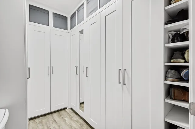 a view of room with walk in closet and closet