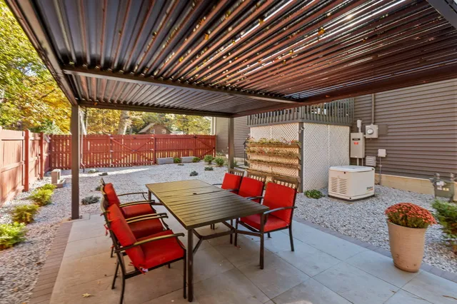 a patio with table and chairs