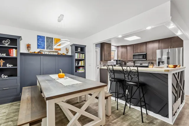 a view of kitchen with cabinets and wooden floor