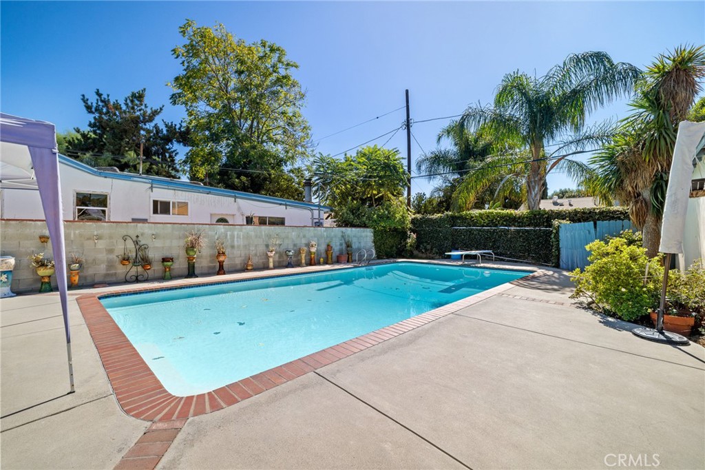 17650 Welby Way Lake Balboa, CA 91406 - Photo 28 of 38 a view of a pool with a yard