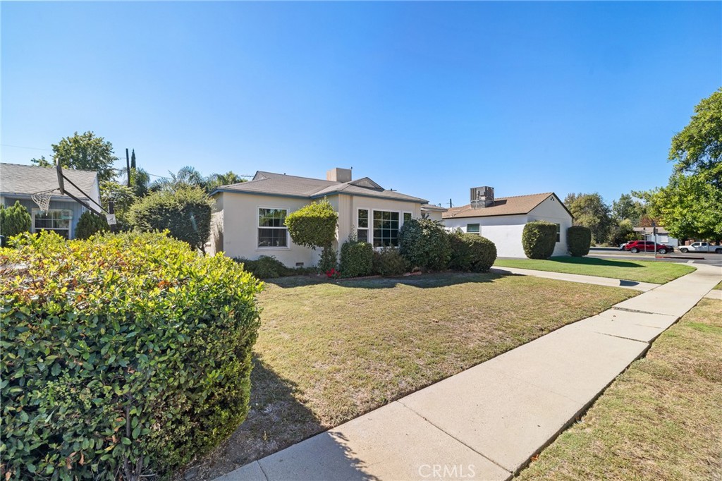 17650 Welby Way Lake Balboa, CA 91406 - Photo 31 of 38 a front view of a house with a yard