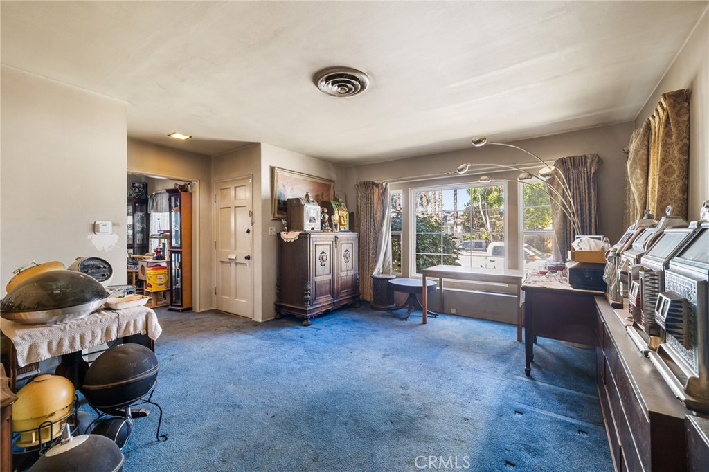 17650 Welby Way Lake Balboa, CA 91406 - Photo 4 of 38 a living room with furniture and a window