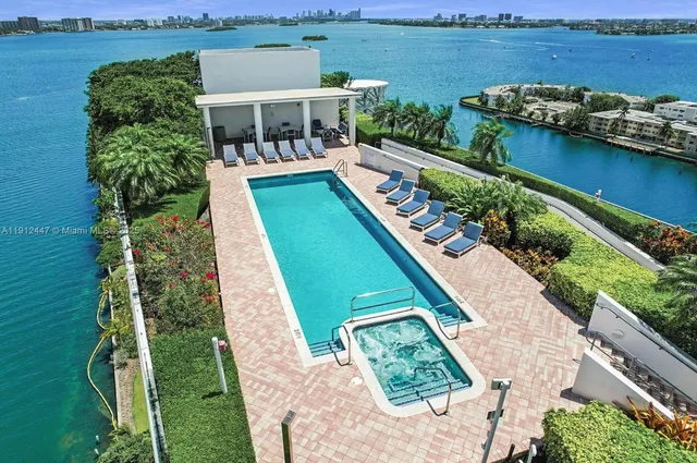 an aerial view of a house with a ocean view