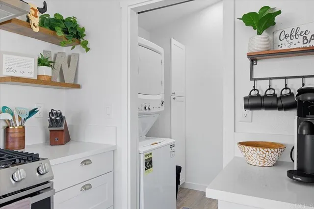 a kitchen with a refrigerator and a stove