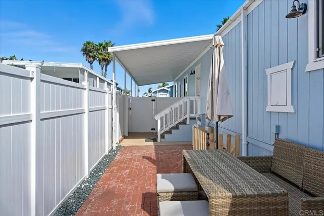 a view of entryway with wooden floor and potted plants