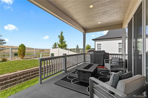 a view of a balcony with chairs
