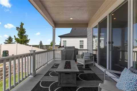 a view of a balcony with chairs