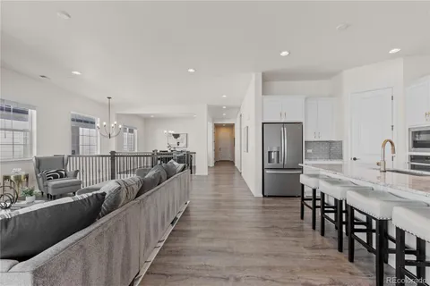 a large kitchen with stainless steel appliances lots of counter space and breakfast area