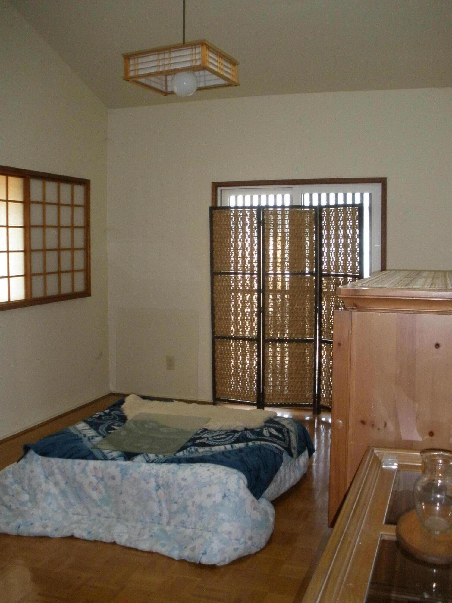 Japanese style room with a dining table and heating under the table