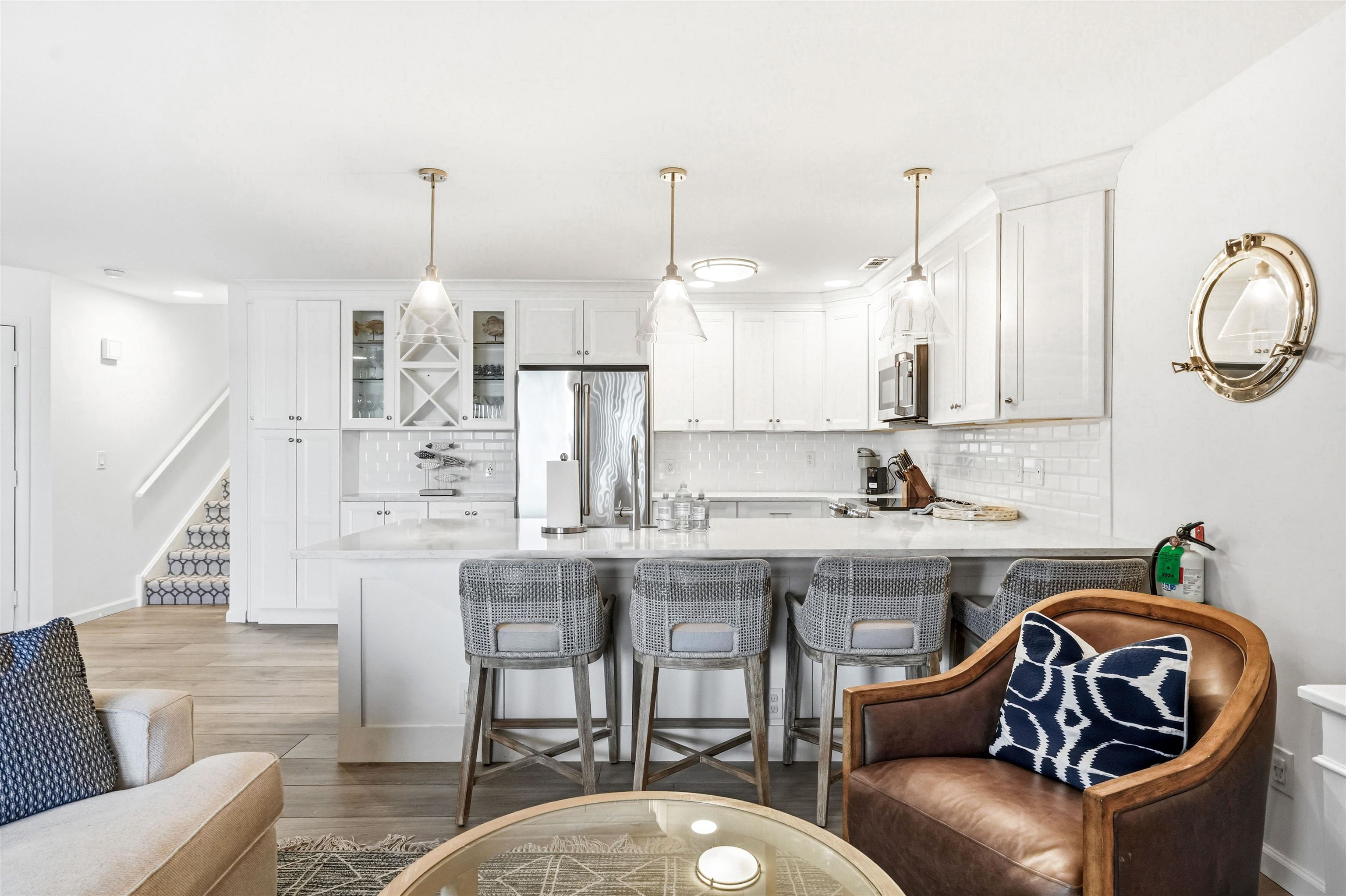 902 Ocean, Unit 906 Cape May, NJ 08204 - Photo 12 of 47 a kitchen with stainless steel appliances granite countertop a stove a sink and a chandelier